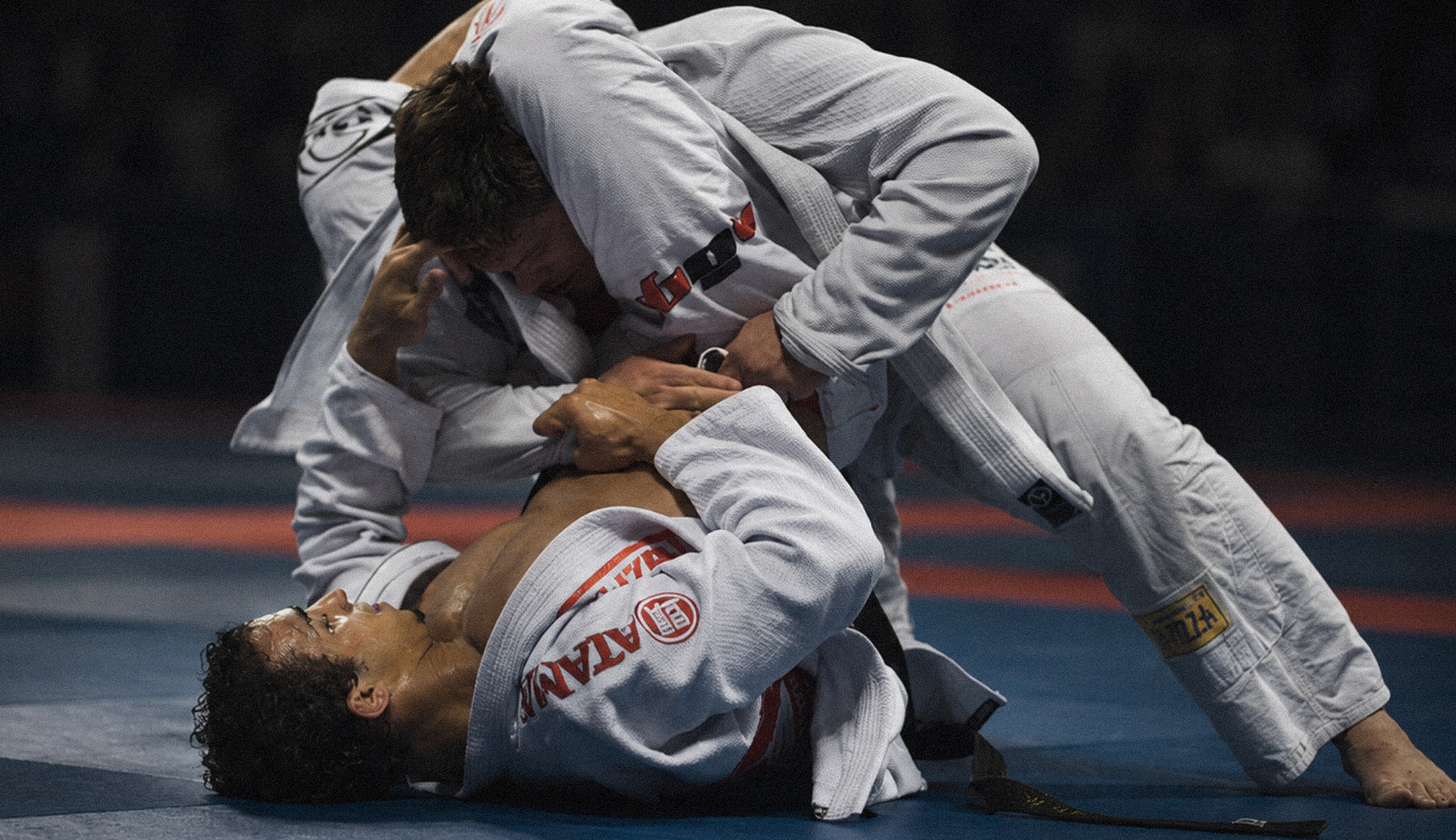Brazilian Jiu-Jitsu athletes competing on the mat